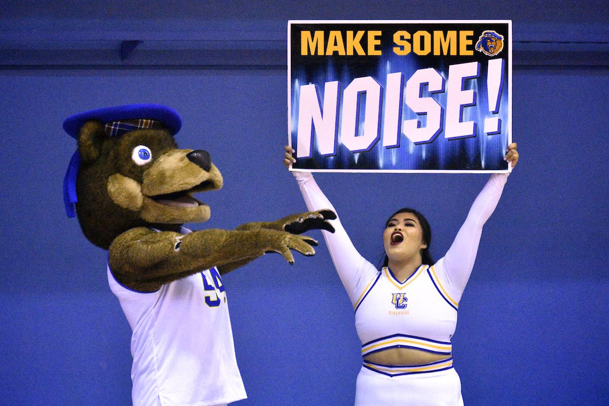 Make Some Noise Homecoming Sign Held by UCR Cheerleader